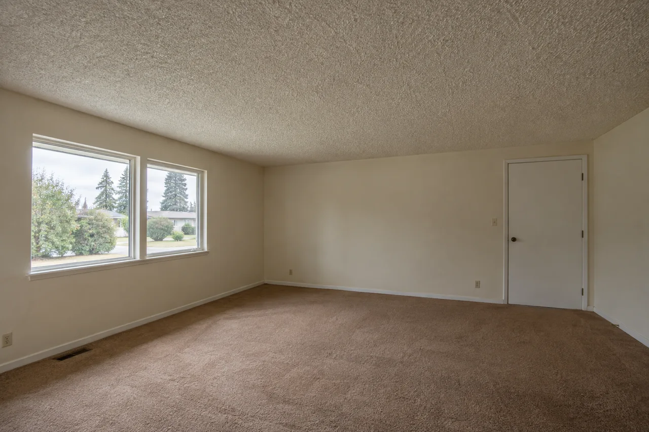 A room with raised popcorn texture across the ceiling.
